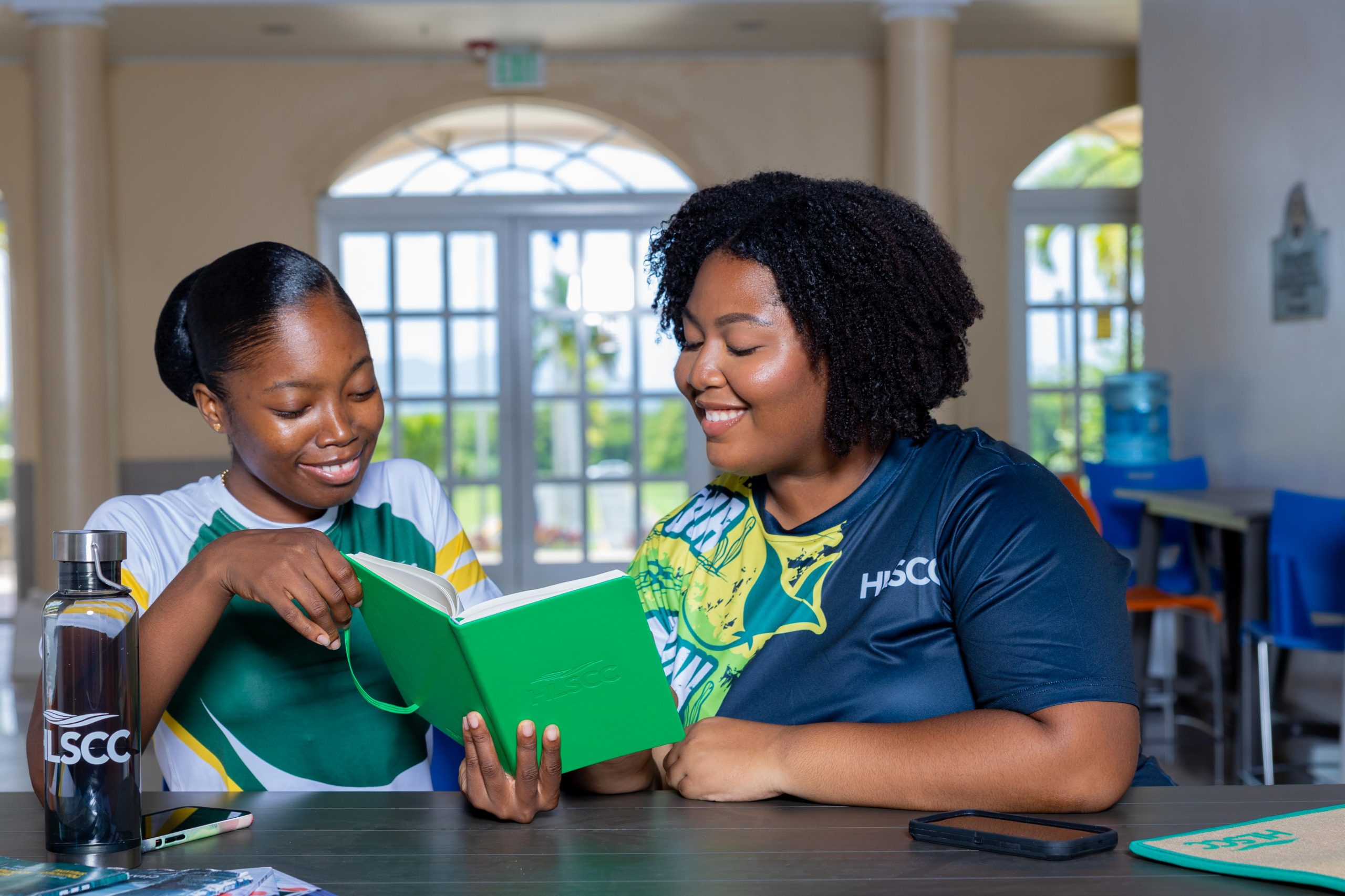 Students with HLSCC notebook and bottle