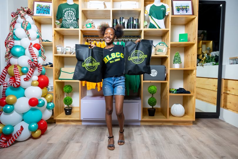 Student holding HLSCC Campus Store bags